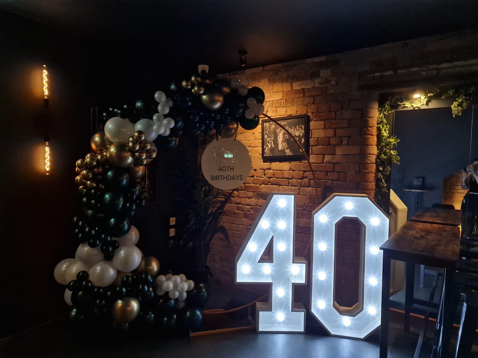 The Cellar — 40th birthday balloon arch event setup