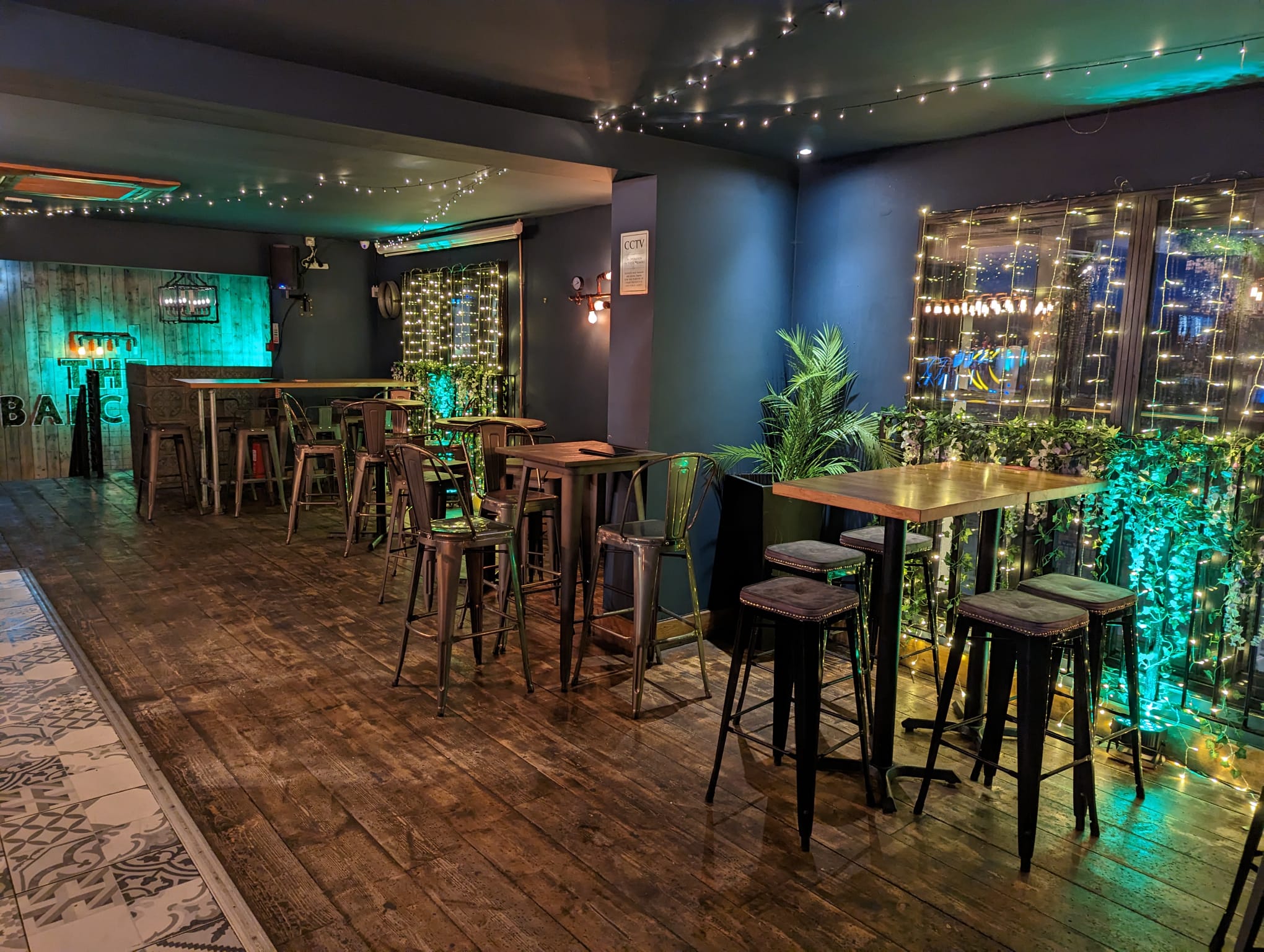 The Balcony interior — fairy lights and bar seating